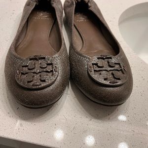 Tory Burch brown leather flats.